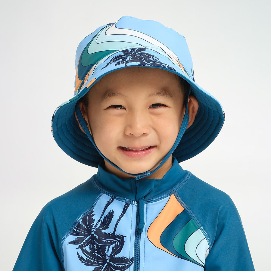 Cancer Council | Infant Palm Waves Reversible Bucket Swim Hat - Lifestyle | Blue | UPF50+ Protection