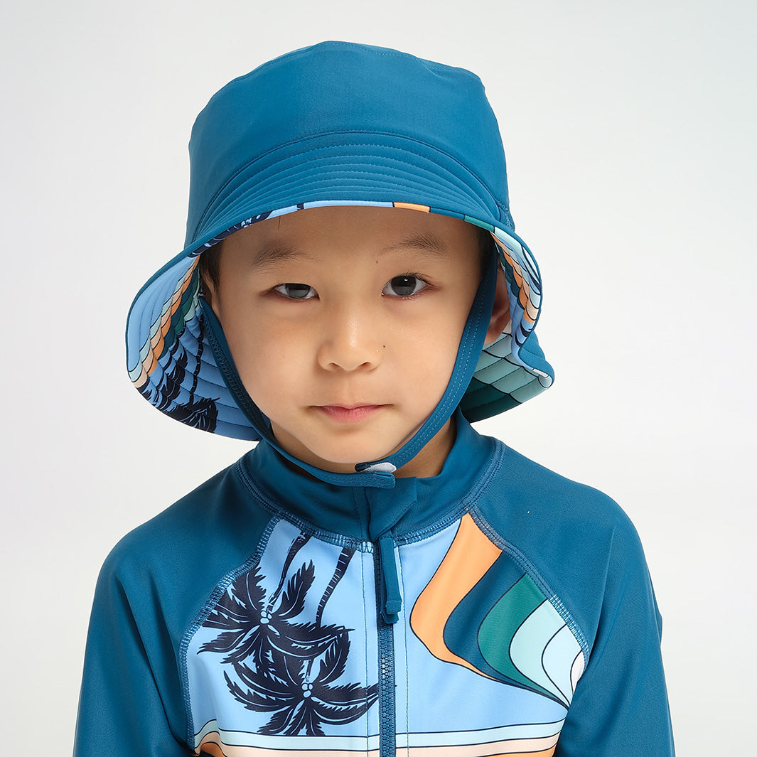 Cancer Council | Infant Palm Waves Reversible Bucket Swim Hat - Reverse | Blue | UPF50+ Protection